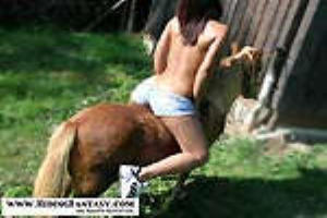 Exotic Anastasia riding her pony outdoor.