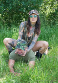 Inked girl in outdoor military domination