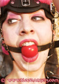Slavegirl gagged with red ball.