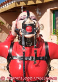 Girl in red latex outdoor lezdom action. 