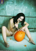 Gothic Halloween Pin-up Babe with her pumpkin 