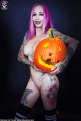 Busty Halloween teen Brandy posing nude with pumpkin