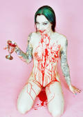 Red-spattered pale vampire beauty with great tattoos