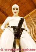 Latexgirls play with strapon dildos. 