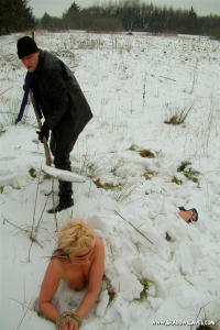 Slavegirl gets buried outdoor in the snow